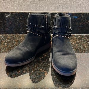 UGG woman’s size 7 boots. Black suede with gold zipper, fringe and grommets.
